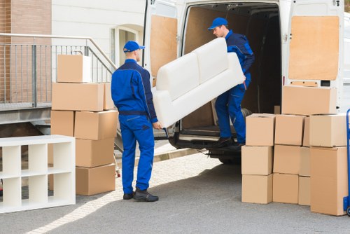 Removal van and moving boxes in a Hammersmith street setting