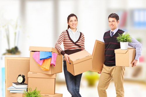 Removal van and moving team in a Hammersmith residential street
