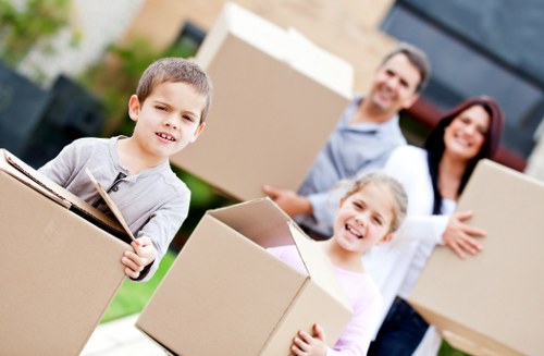Local removals team loading furniture for a move in west London