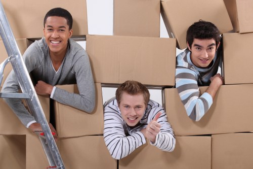 Preparing boxes and furniture for a moving truck in Hammersmith