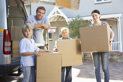 Loading household furniture into a removal truck in West London