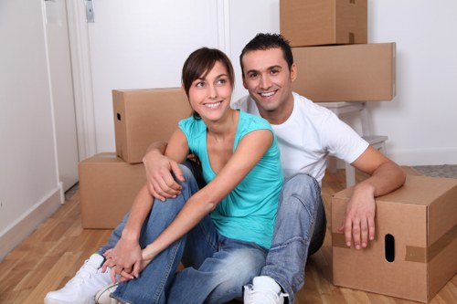 Unpacking boxes and arranging belongings in a new Hammersmith property