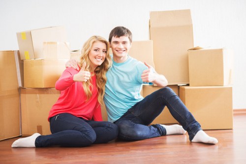 Moving team unloading boxes at a Hammersmith property
