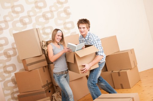 Packers handling furniture and fragile items for a house move in Hammersmith