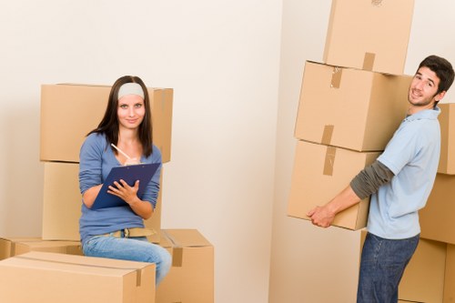 Packed moving boxes and furniture ready for transport